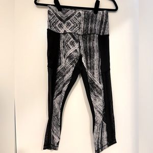 Lululemon athletic tights.  Mid calf length.  Sheer on the side.  Gently warn